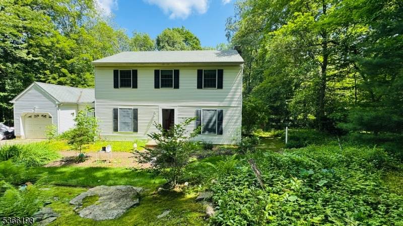 Charming country style colonial home built in 1977, nestled on over an acre in the peaceful countryside of Newfoundland, NJ.