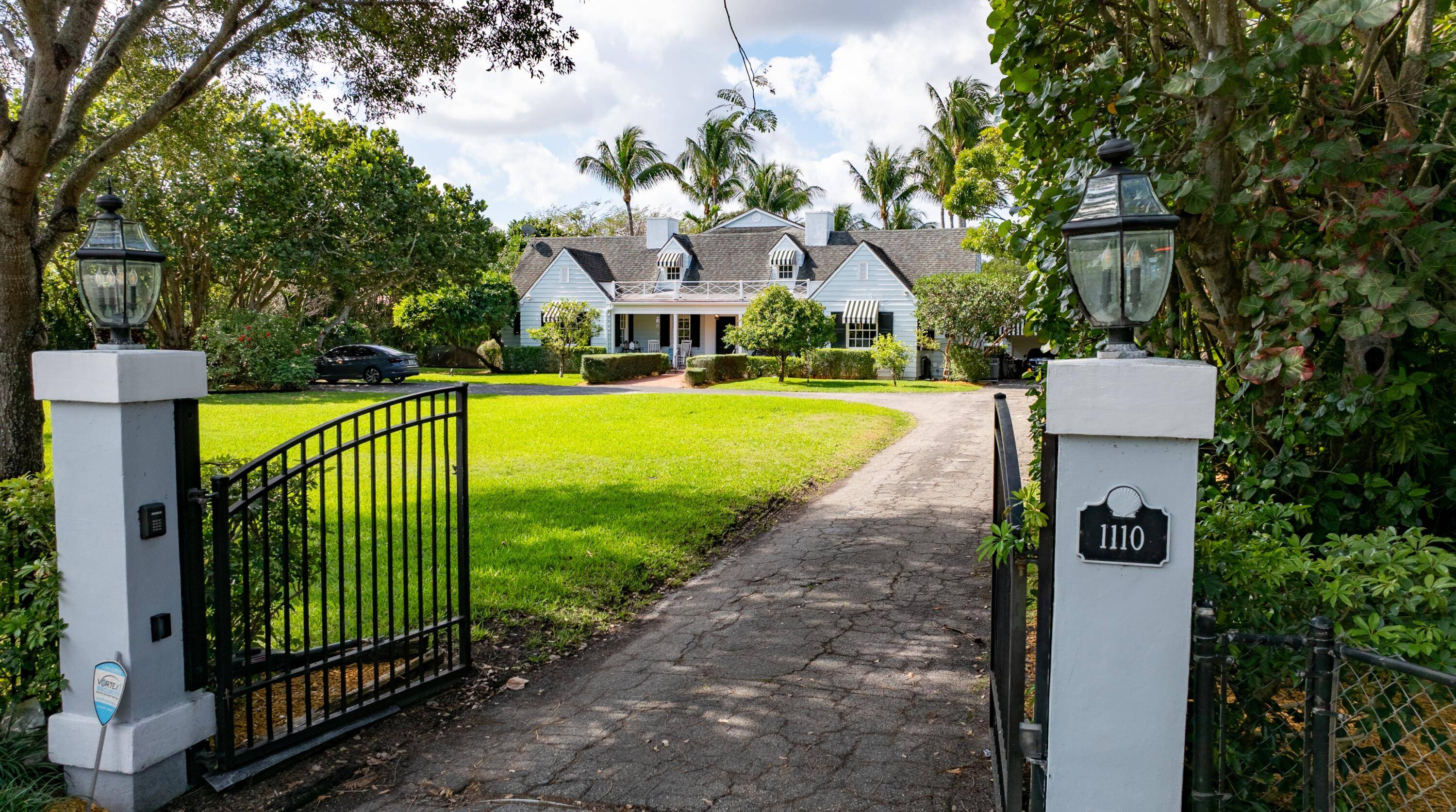 An exceptional offering, this 1936 era historic colonial farmhouse style estate presides over 1.