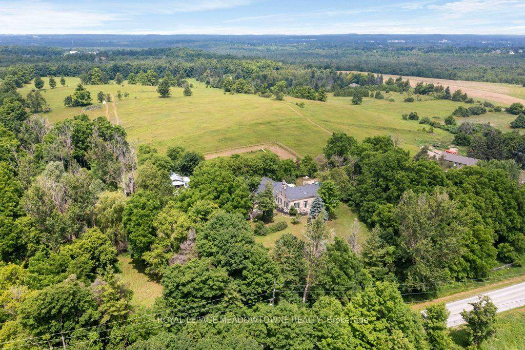 Experience the timeless beauty of this majestic 1832 Century Stone Farmhouse, nestled on a private 10 acre setting for the ideal hobby farm.