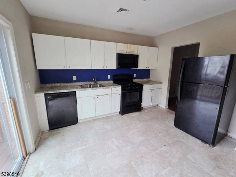 Investor's Dream Two Family Home with Garage, Driveway, Central Air Huge Attic !