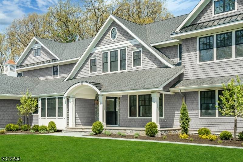Discover the ultimate in luxury living in this stunning Nantucket style residence, perfectly situated in Short Hills' coveted Hartshorn section.