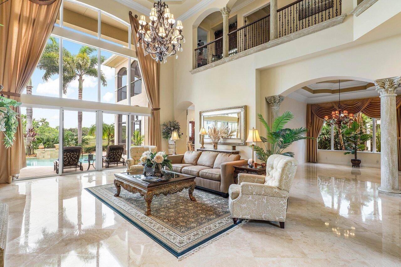 Overlooking the Tesoro River Preserve, this 2 story Custom Creation with 4 bedrooms, 4 en suite baths, and 2 half baths features distinctive scenic views of Water, Wildlife, Golf, and ...