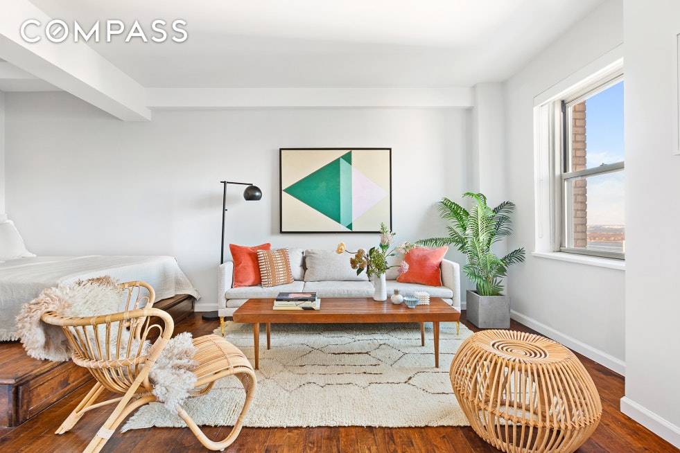 Featured in the New York Times and boasting stunning views of the NY Harbor and Downtown Manhattan, Residence 17C at the historic St.