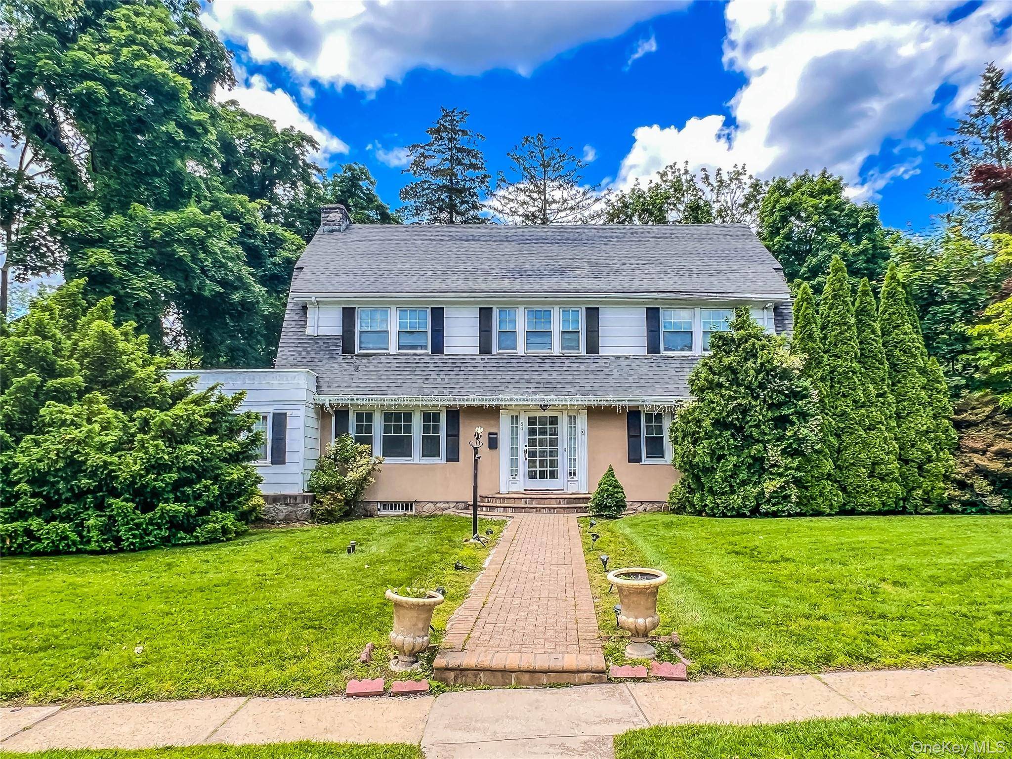 Six Bedroom Center Hall Colonial with Traditional Formal Rooms, Large Bedrooms, and a Primary Suite.