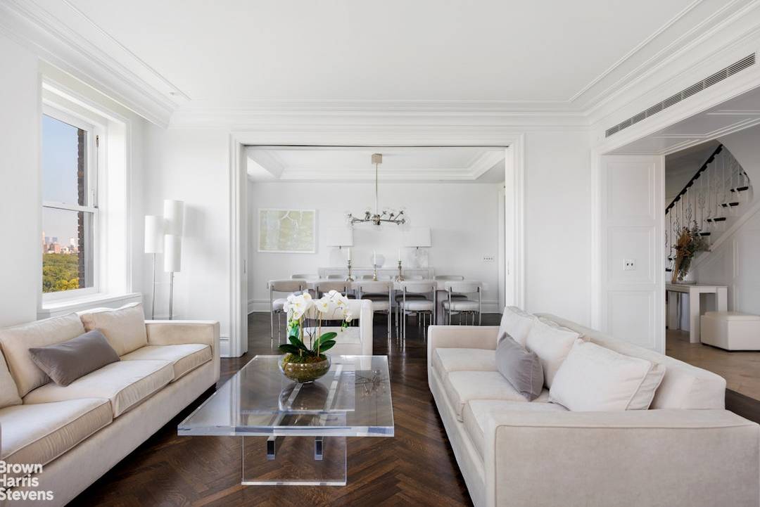 Located on Fifth Avenue's Museum Mile, this penthouse duplex boasts panoramic views of Central Park, the reservoir, and dramatic skyline views to Midtown Manhattan and beyond !