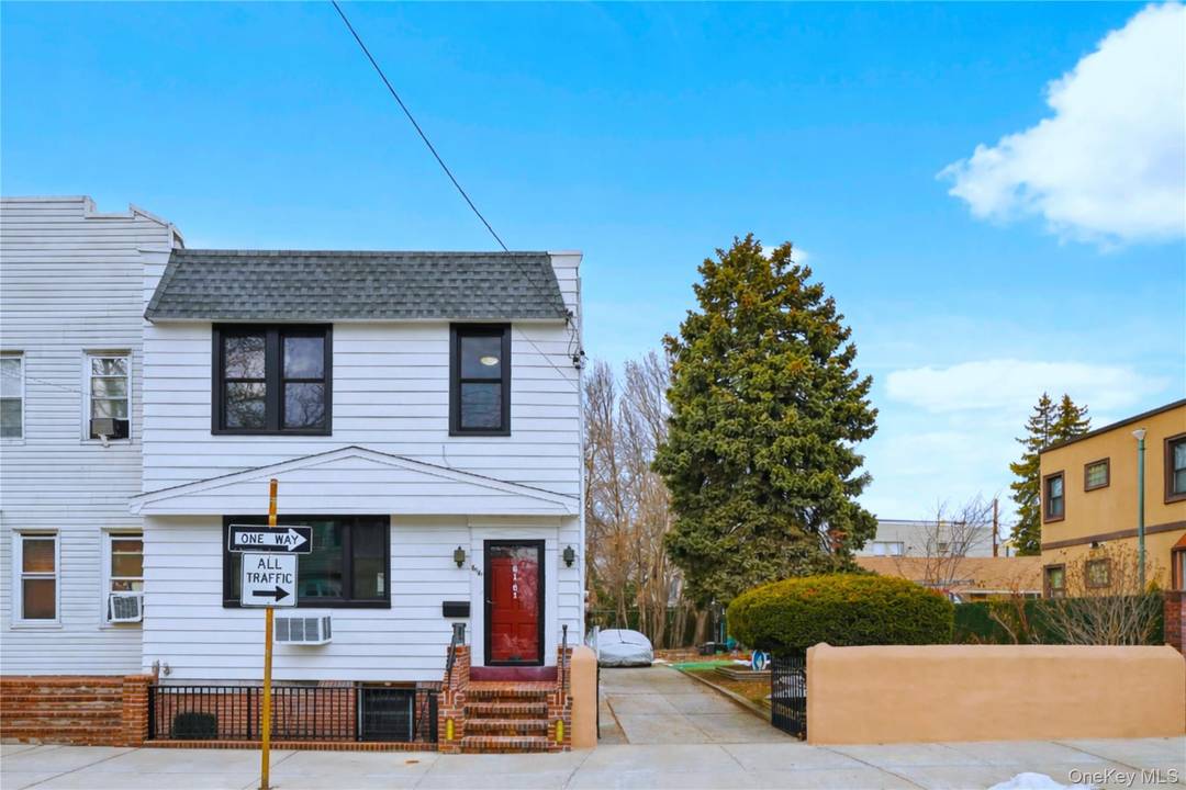 Set on a rare double lot in the heart of Middle Village, this beautifully maintained home offers a unique blend of classic character and modern enhancements.