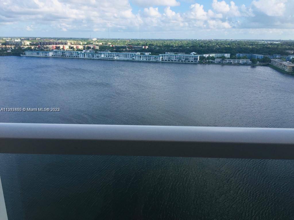 Large 1 bedroom with totally unobstructed views of wide lake from every room Walk in closets, washer and dryer in unit
