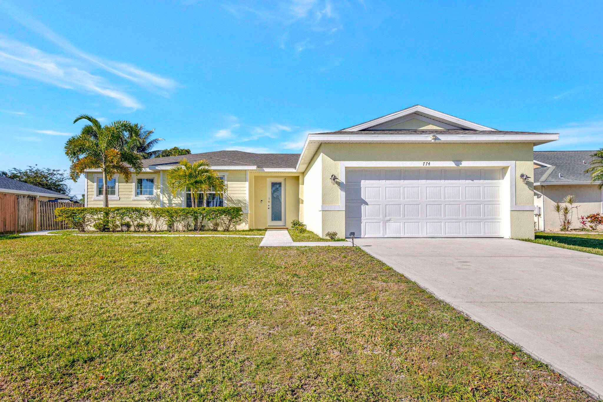 This income producing 4 3 2 home is located 11 miles from the beach in a quiet neighborhood of custom homes near boat docks and the Botanical Gardens.