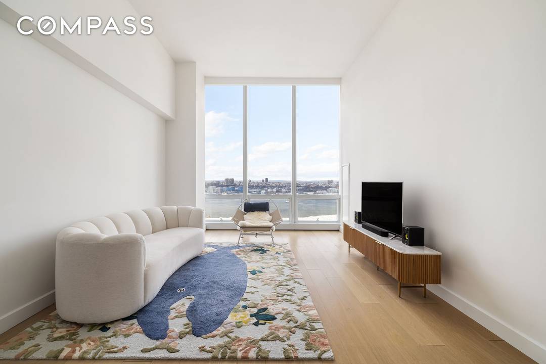 This stunning one bedroom residence boasts soaring 12 foot ceilings and panoramic Hudson River views.