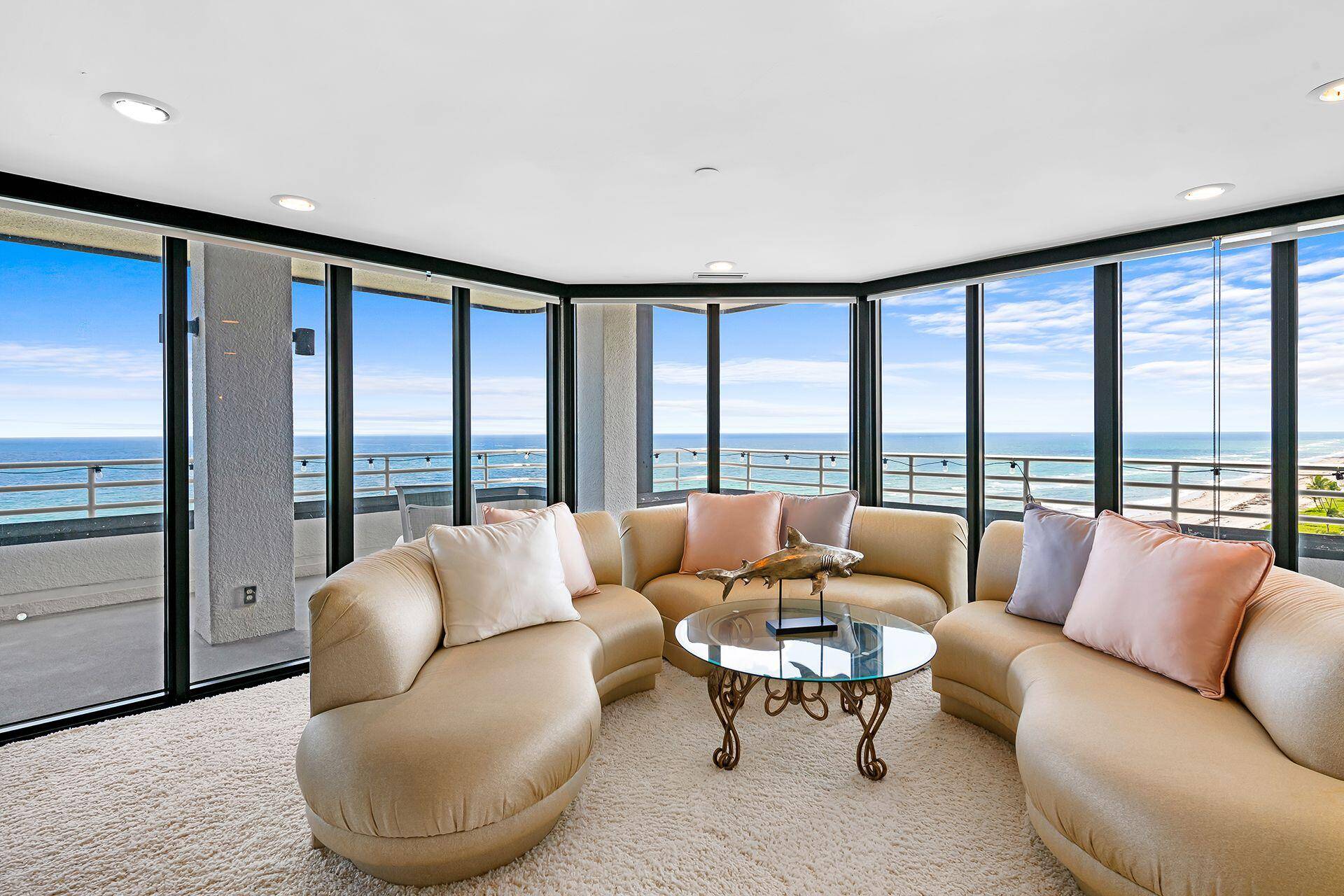 Breathtaking Ocean and Intracoastal views from this SE Corner Penthouse, directly on the sand.