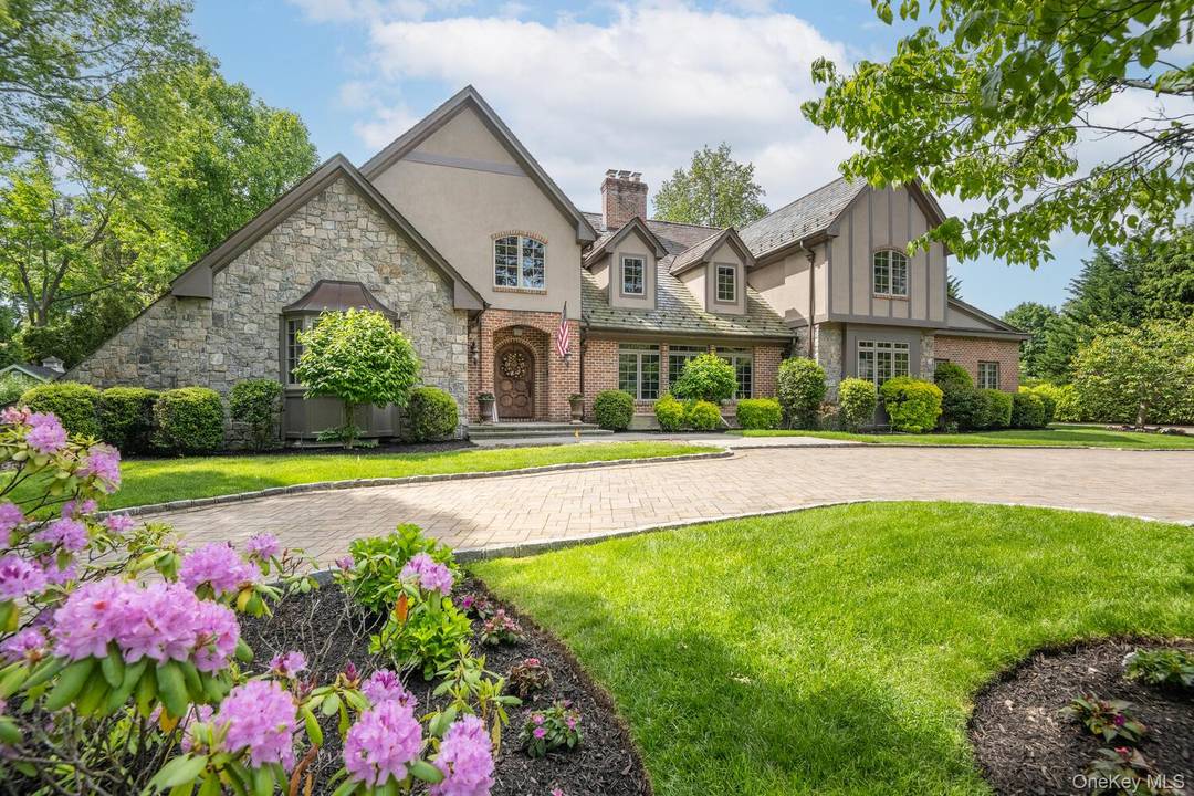 This stately custom built home offers 5 bedrooms and 4.
