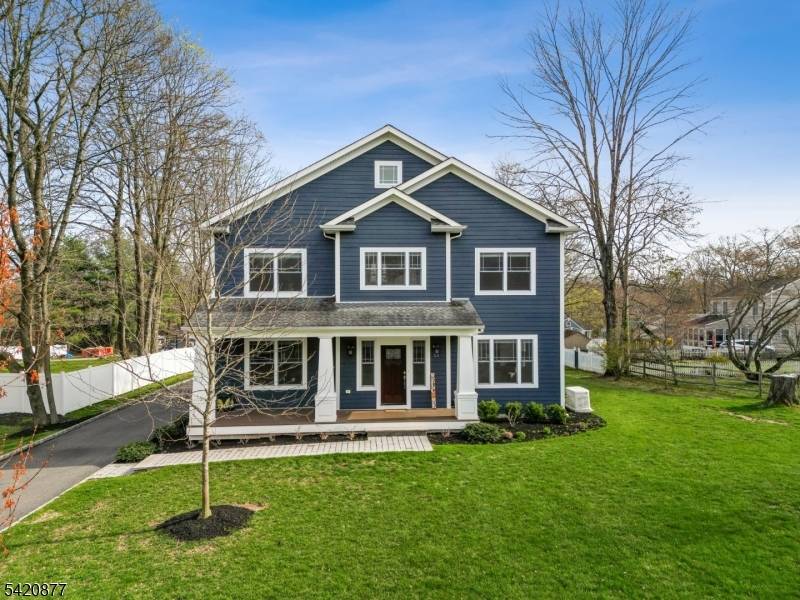 This exquisite Colonial set on a private, tree lined property in prestigious Basking Ridge offers refined living at every turn.