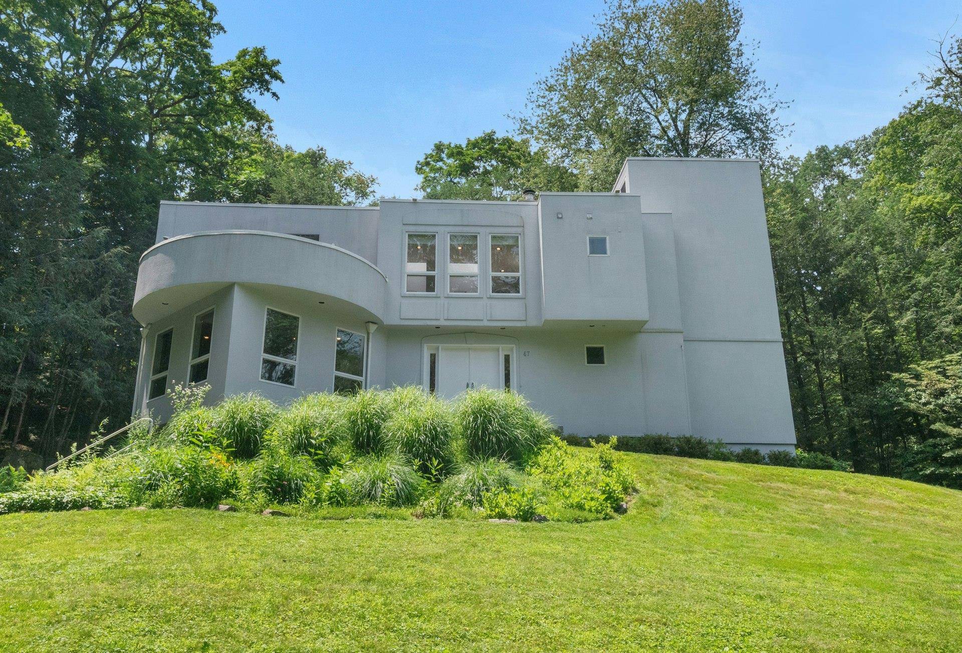 This sleek contemporary is located in the heart of Katonah within walking distance to town, train and the elementary school.