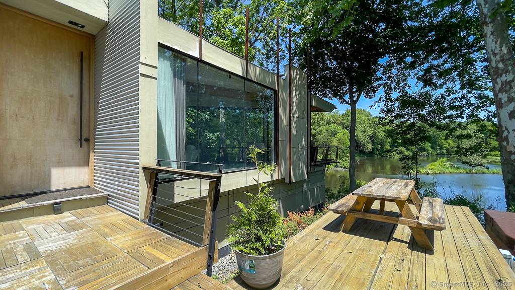 Welcome to 47 Still River Drive a stunning, modern summer rental nestled directly on the Still River, just off scenic Lake Lillinonah.