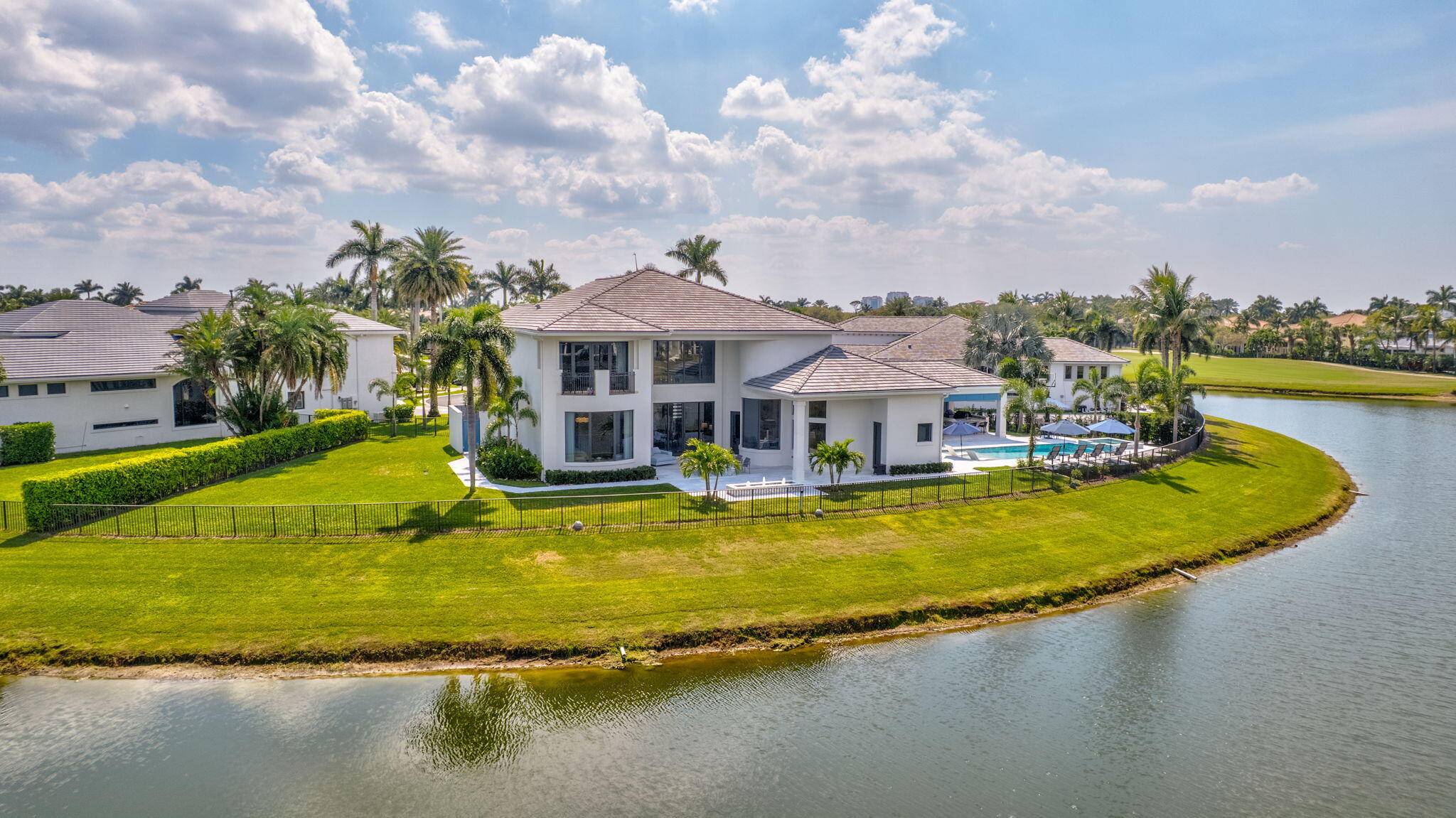 CUSTOM ESTATE with Panoramic Water Golf Views in a Prestigious Location.