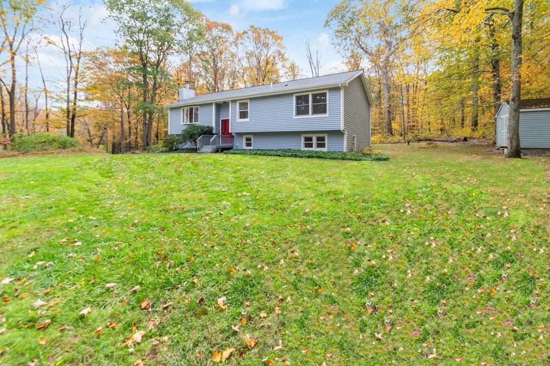 COMPLETELY REMODELED OVERSIZED RAISED RANCH on nearly 4 PRIVATE ACRES in Southbury the perfect blend of modern comfort and peaceful country living.