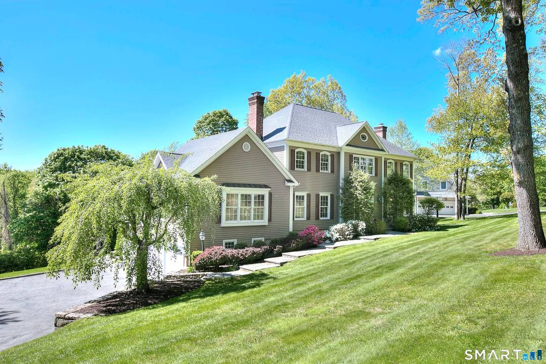 Situated in a highly sought after neighborhood, this stately 4BR 4.