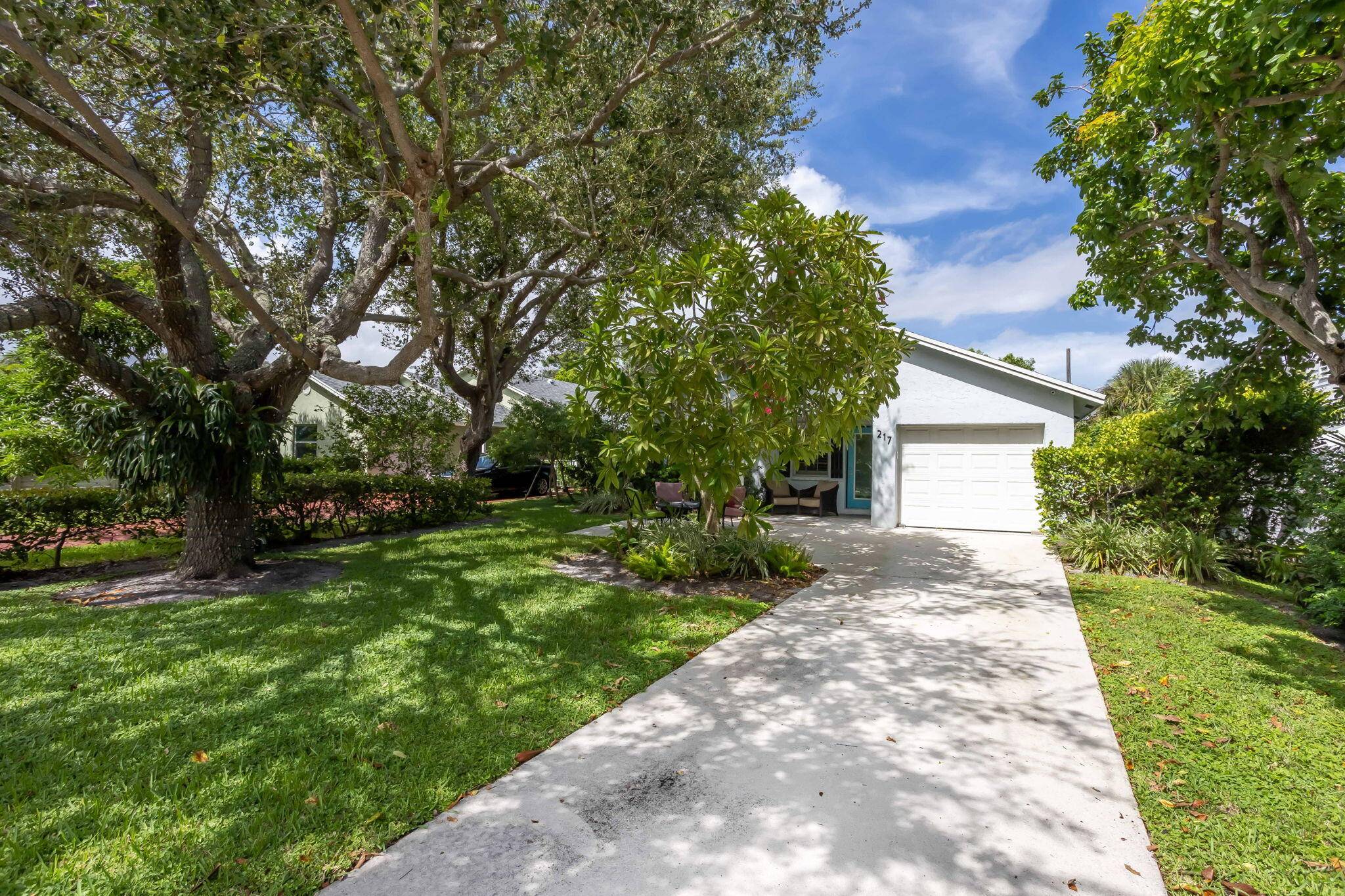 A private retreat just steps from Atlantic Avenue, Pineapple Grove, and the beach, this exquisitely updated single story residence captures the essence of refined coastal living.