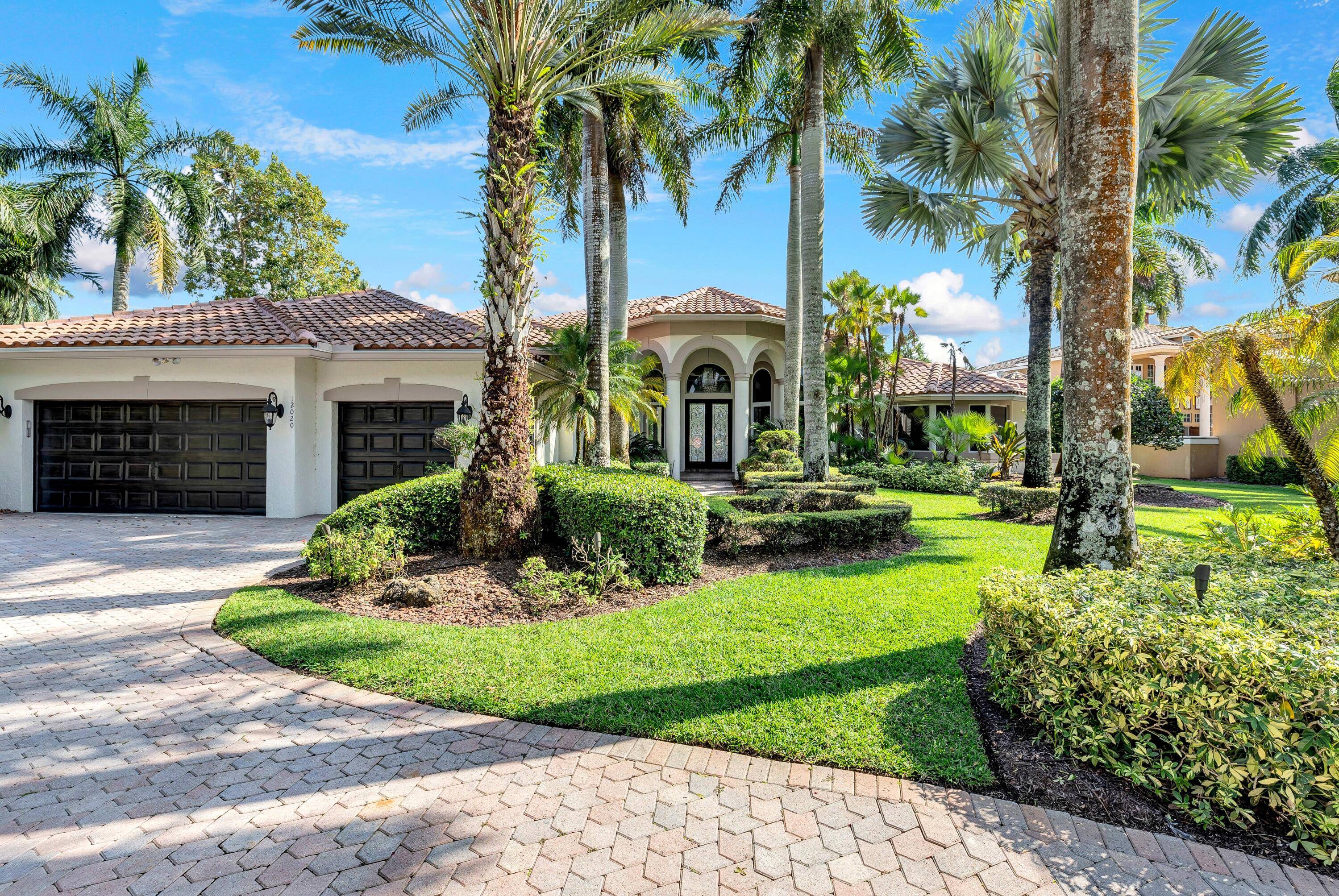 Stunning single story home located in the prestigious double gated community of The Falls at Heron Bay.