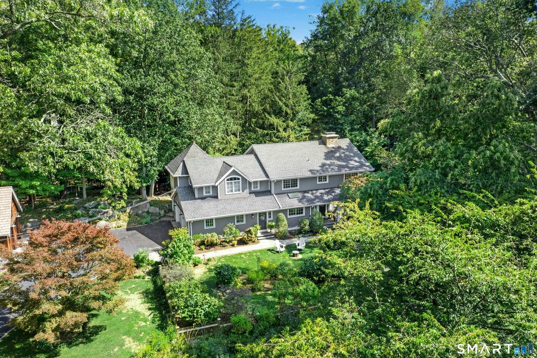 Rarely do you find a property that has it all a spacious move in ready house with a pool, and a private one acre parcel close to everything Darien has ...