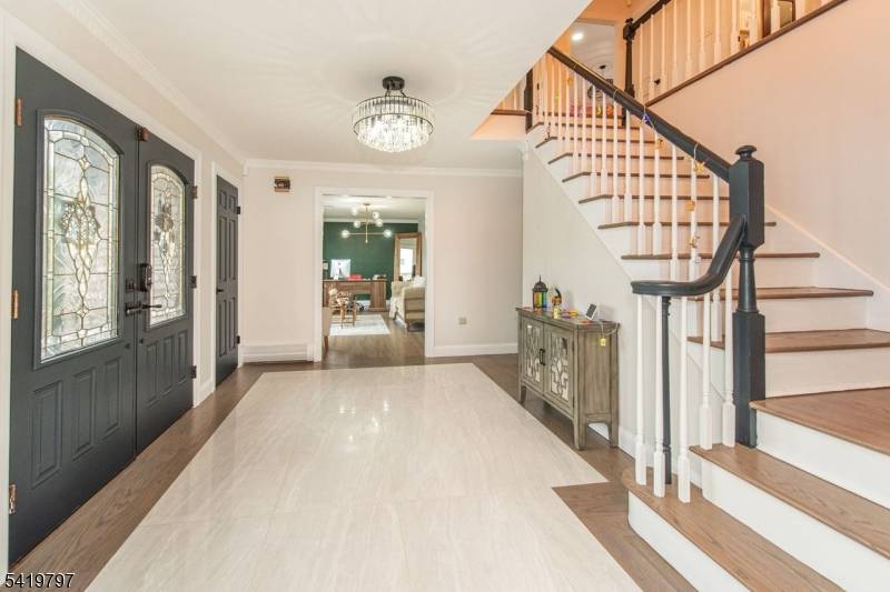 Welcome to this brick front Center Hall Colonial offering over 3000 sq ft of living space.