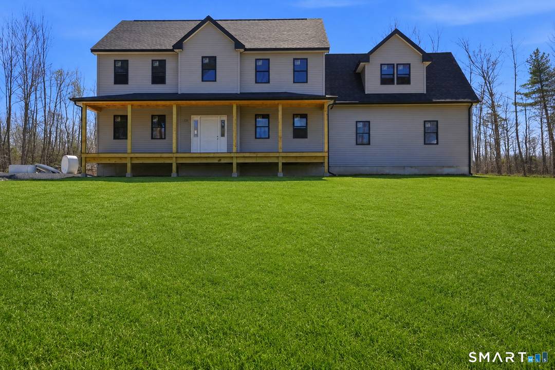 Stunning new construction Colonial set on over 2 private acres in a serene country location.