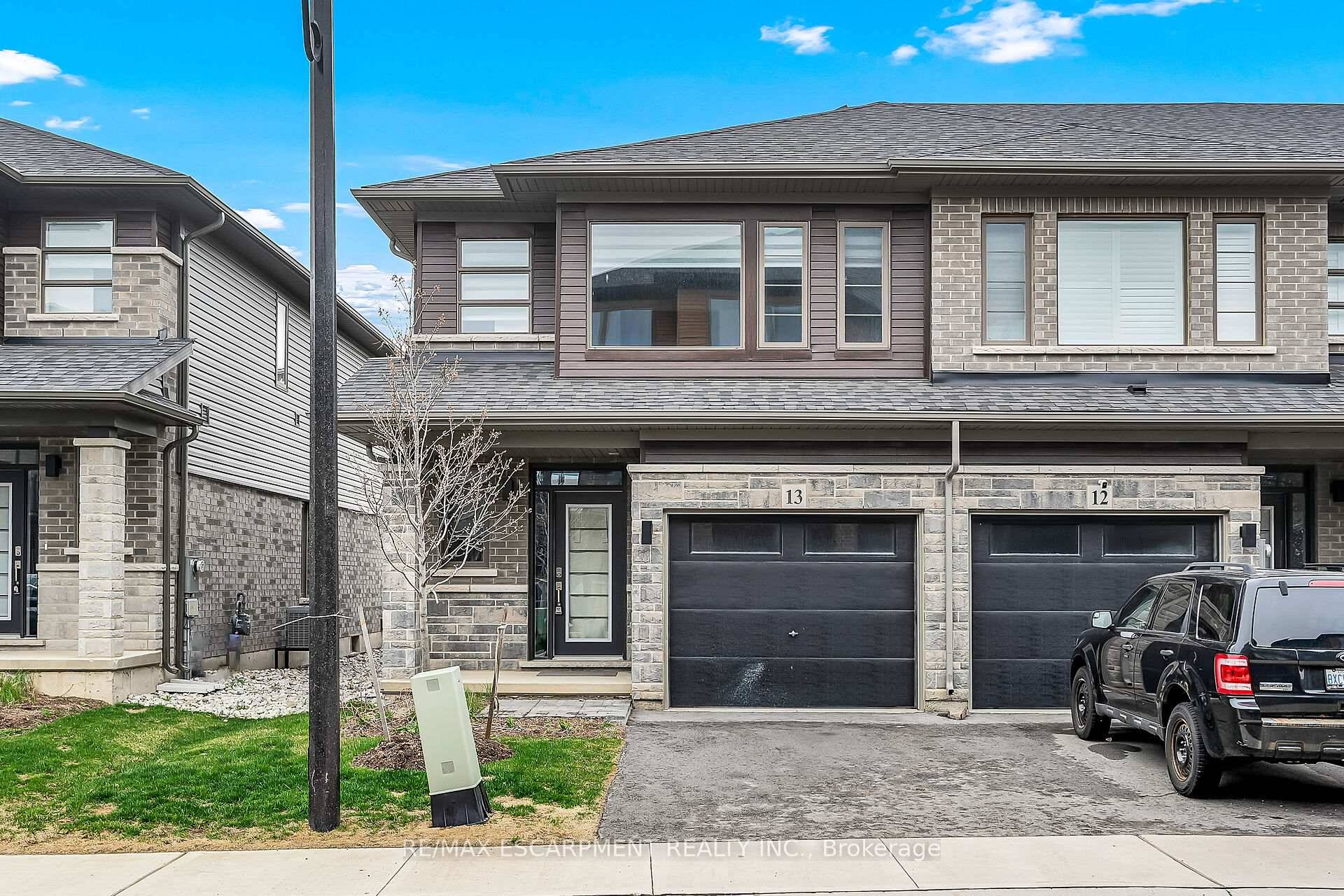 Welcome to 61 Soho Street a stunning, 1602 sq ft freehold end unit townhome built in 2023, nestled in the sought after Central Park community.
