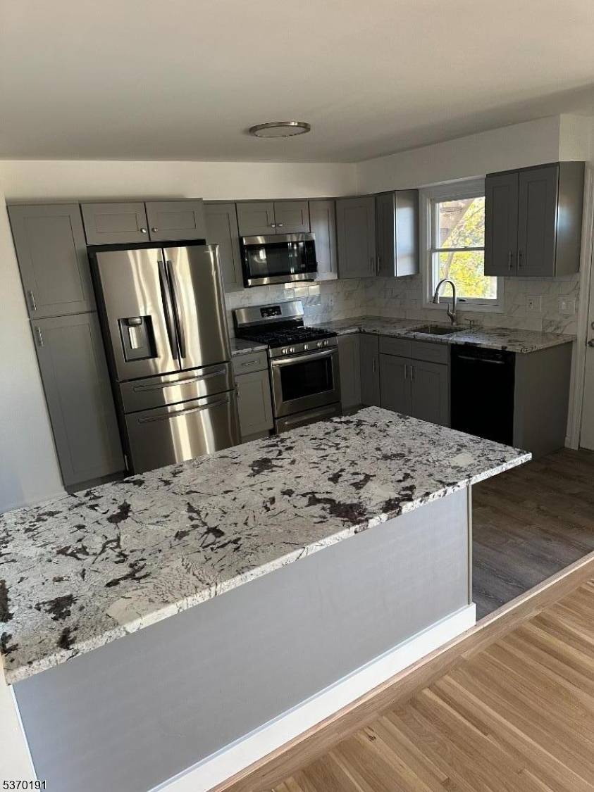 Fantastic investment or live rent opportunity in this spacious and beautifully updated two family home located on a quiet cul de sac in Woodland Park.