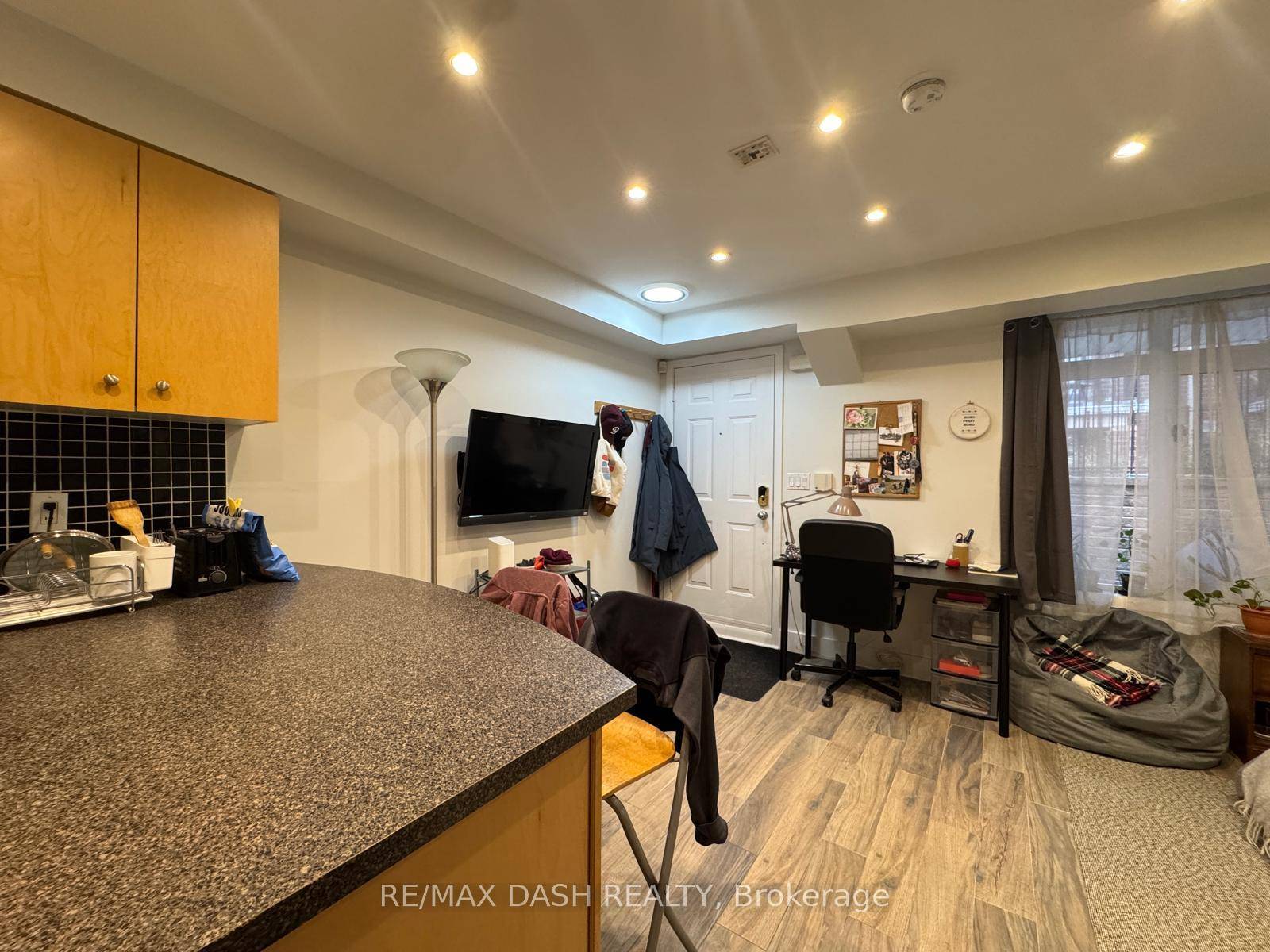 Welcome To This Impeccably Maintained Furnished Studio Townhouse Unit, Featuring Stylish Laminate Flooring Throughout.