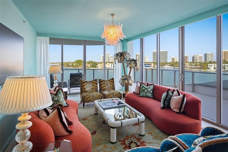 Wake up everyday to sparkling turquoise water and shimmering skyline views in this one of a kind, corner residence !
