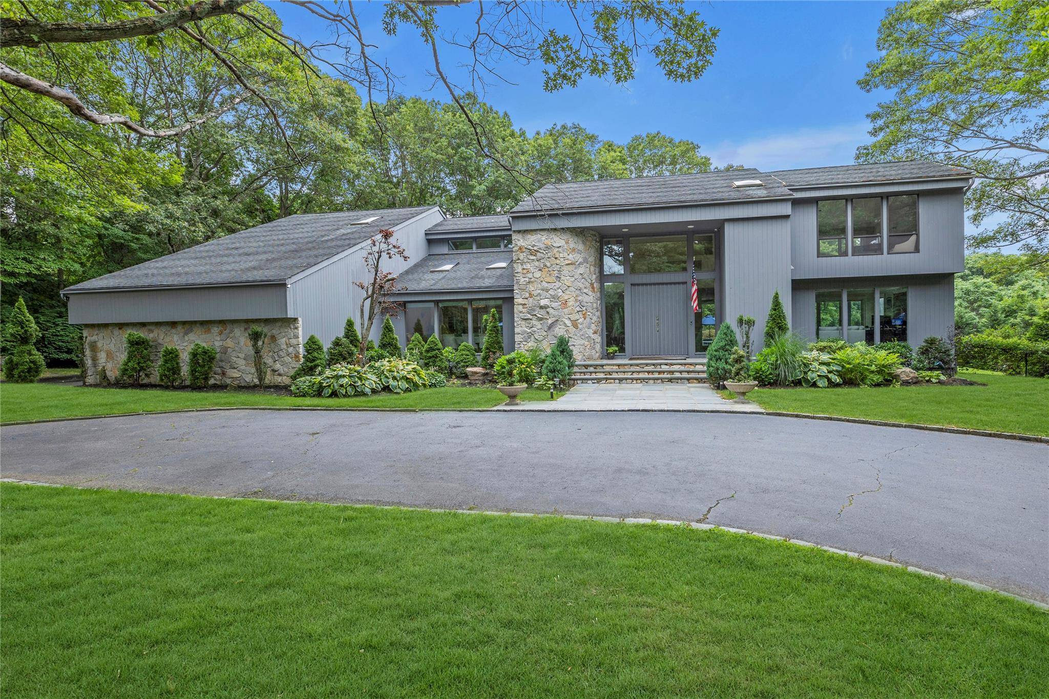 Tucked away at the end of a serene cul de sac, this spectacular modern retreat is situated on 2.