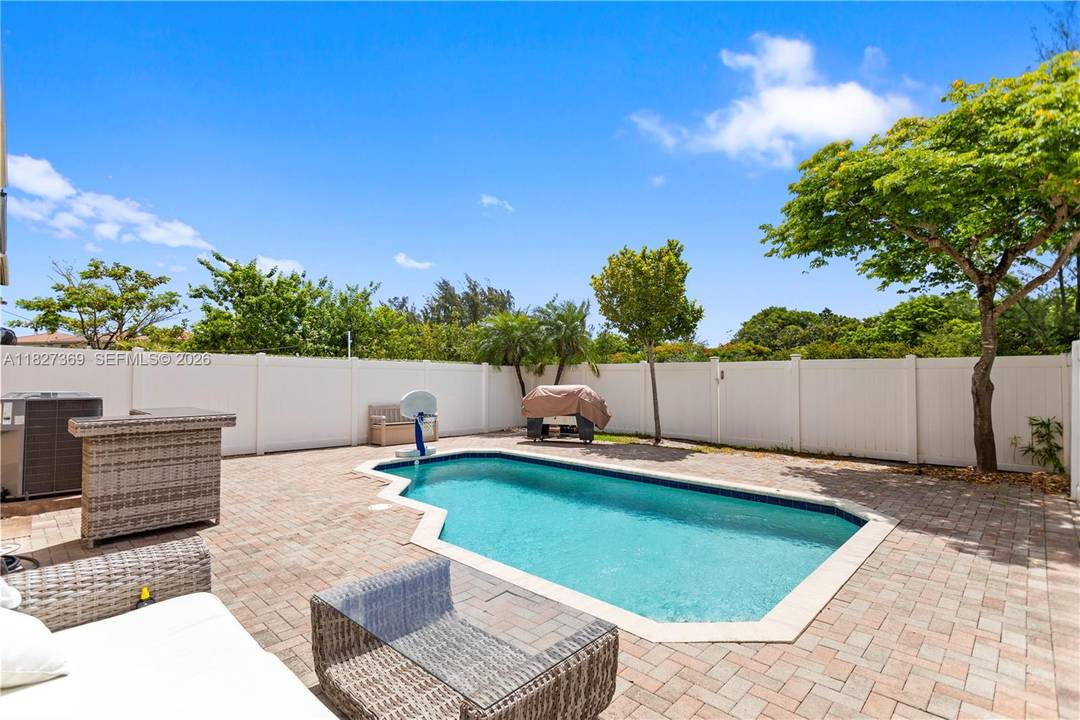 REDUCED AND PRICED RIGHT FOR FAST SALE SPACIOUS POOL HOME WITH OVERSIZE BACKYARD PLUS WALKING, JOGGING AND BIKING PATH RIGHT BY YOUR BACKYARD NO REAR NEIGHBOURS IN DESIRABLE AVENTURA ISLES ...