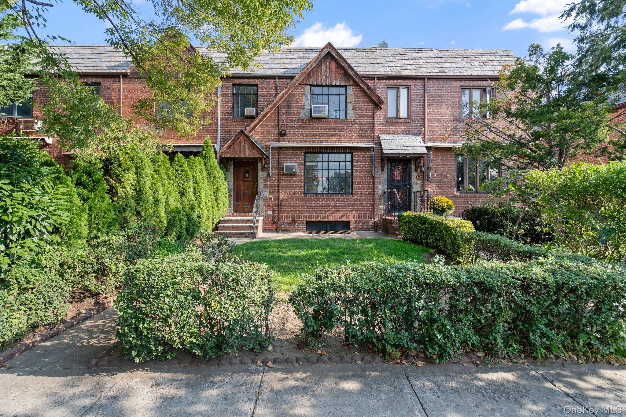 Single family attached 20 foot brick townhouse in the heart of Forest Hills !