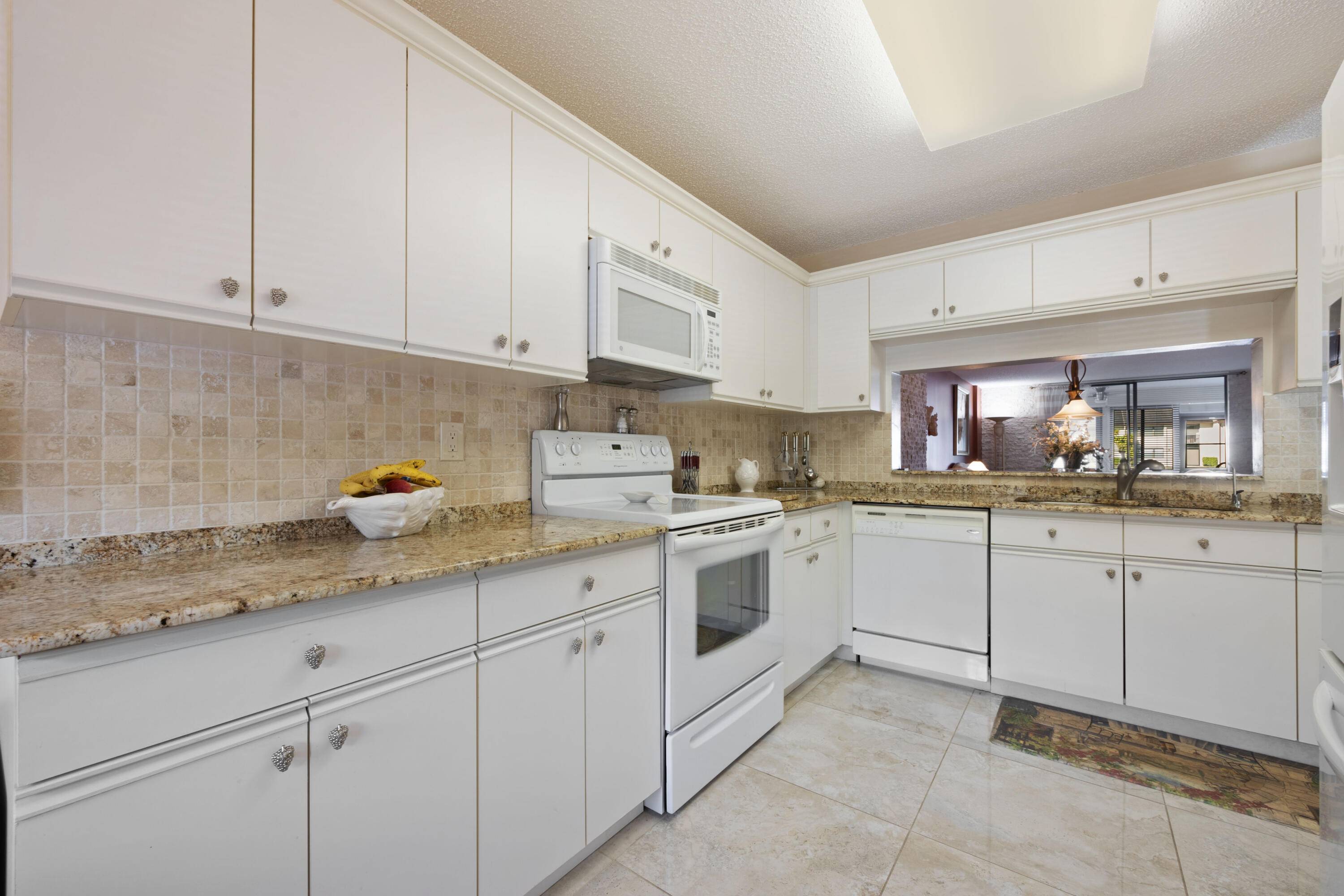 Beautiful and spacious 2 bedroom 2 bath first floor condo in Fairway Club at Lucerne Pointe.