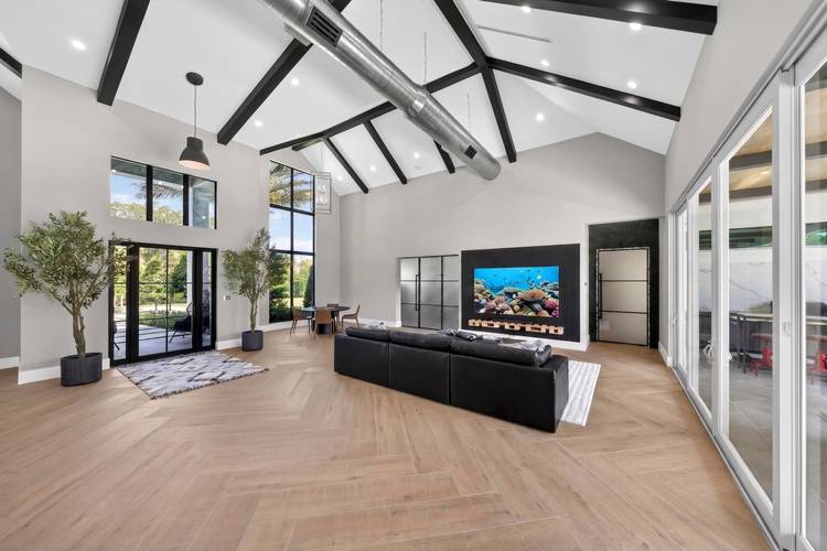 Luxurious Private Estate New Construction 2025 Turn Key, Low Maintenance Living Set on A nearly 2 acre high and dry agricultural estate lot fully surrounded by a concrete wall, this ...