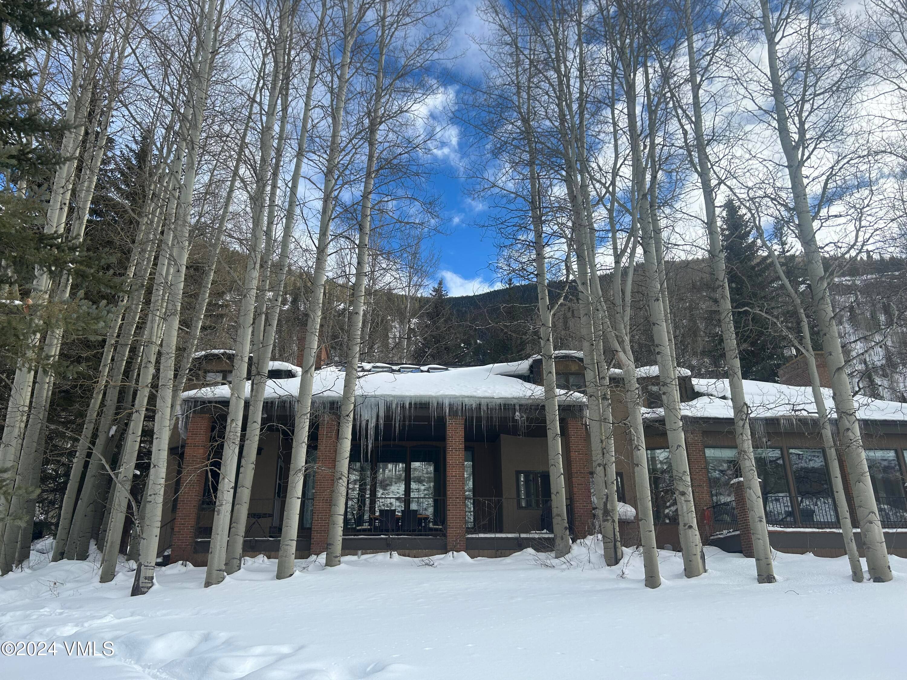 Rare opportunity to own a home with golf course frontage on the 18th fairway of the Vail Golf Course.