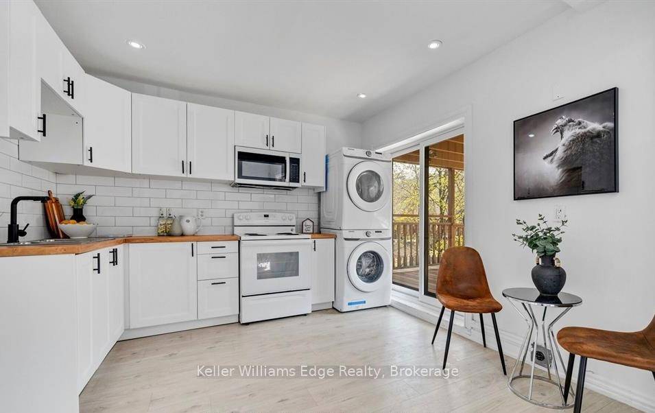 All inclusive living with parking included in this bright and updated 2 bedroom, 1 bath second floor unit in a well maintained triplex in the desirable St.