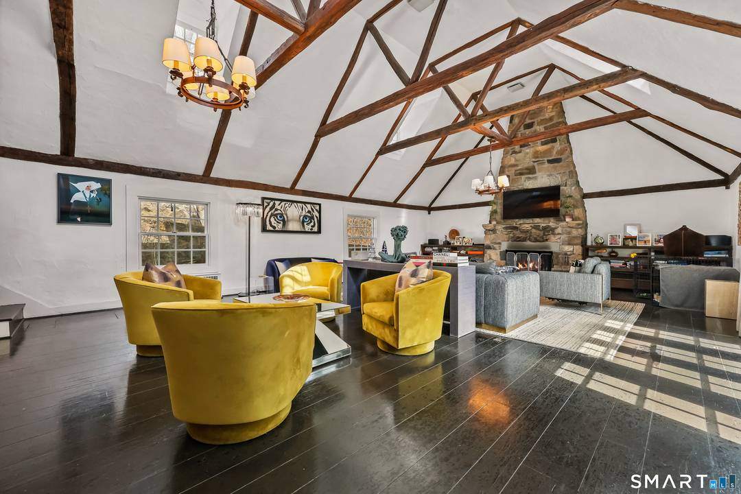 Set on a private, wooded property in a prime Stamford location, this residence blends architectural character with exceptional indoor outdoor living.