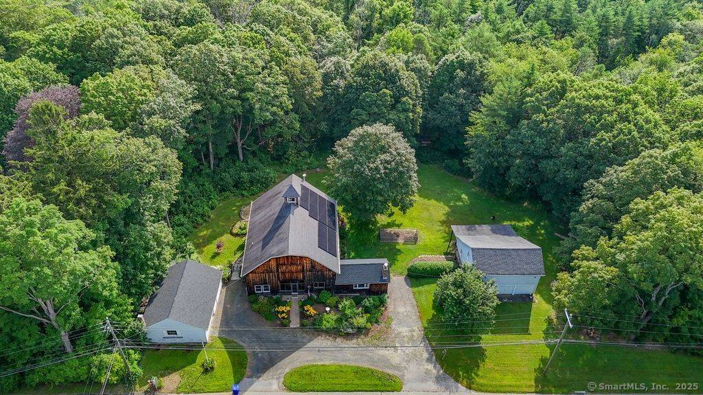 This charming and unique post and beam converted dairy barn, once part of Walnut Hill Farm, is full of character.