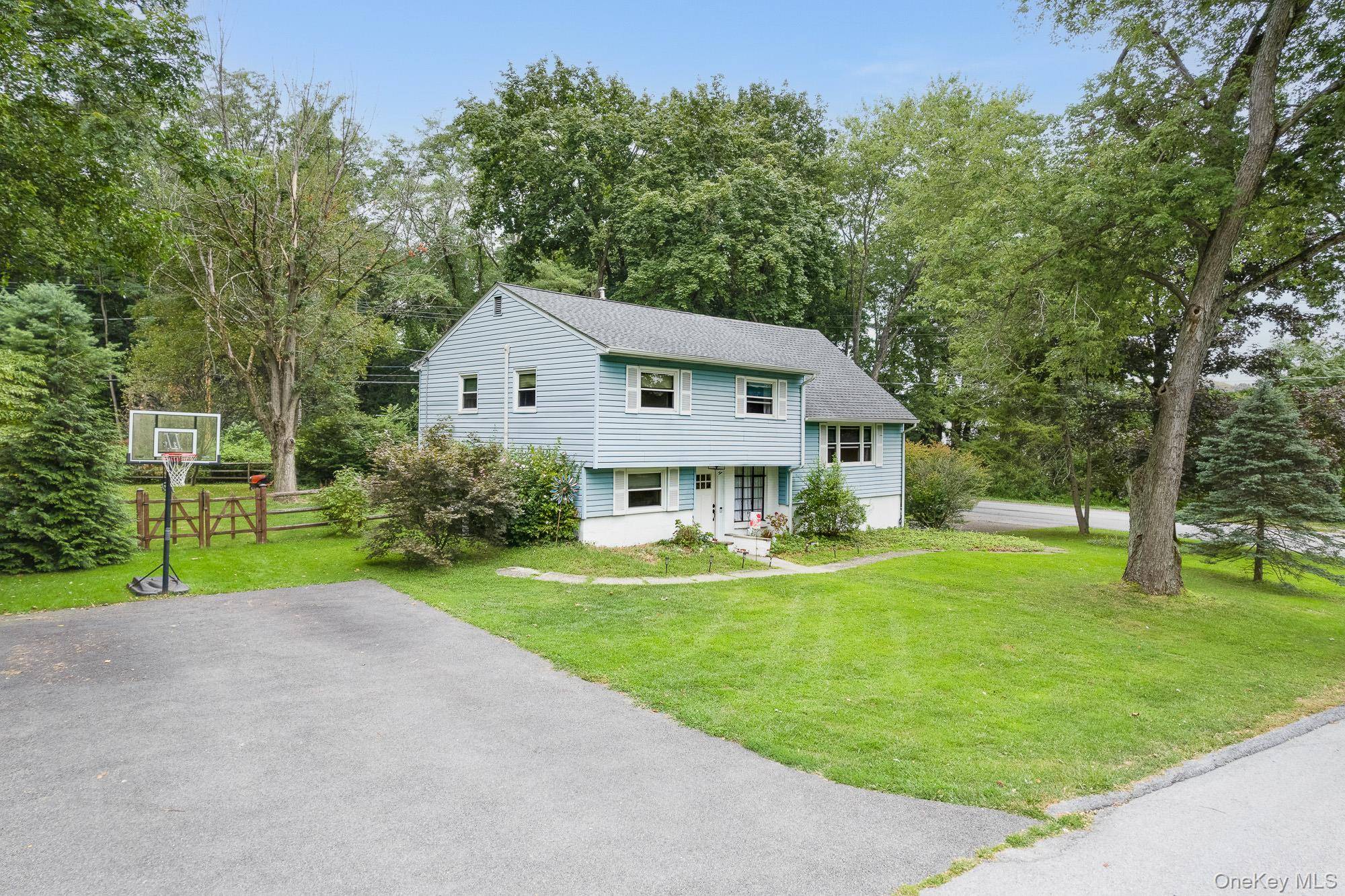Spacious and welcoming 4 bedroom, 2 full bath multi split level on a large corner lot all within the highly sought after Spackenkill school district.