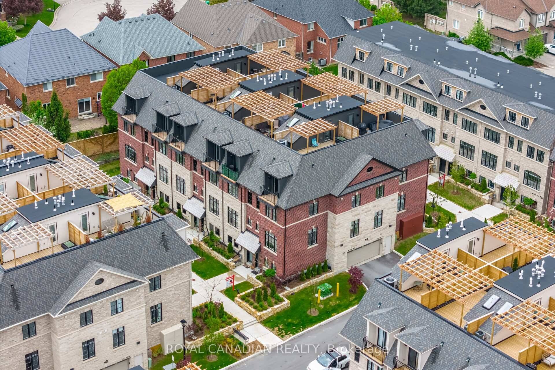 2025 built corner townhouse with an abundance of natural light and windows.