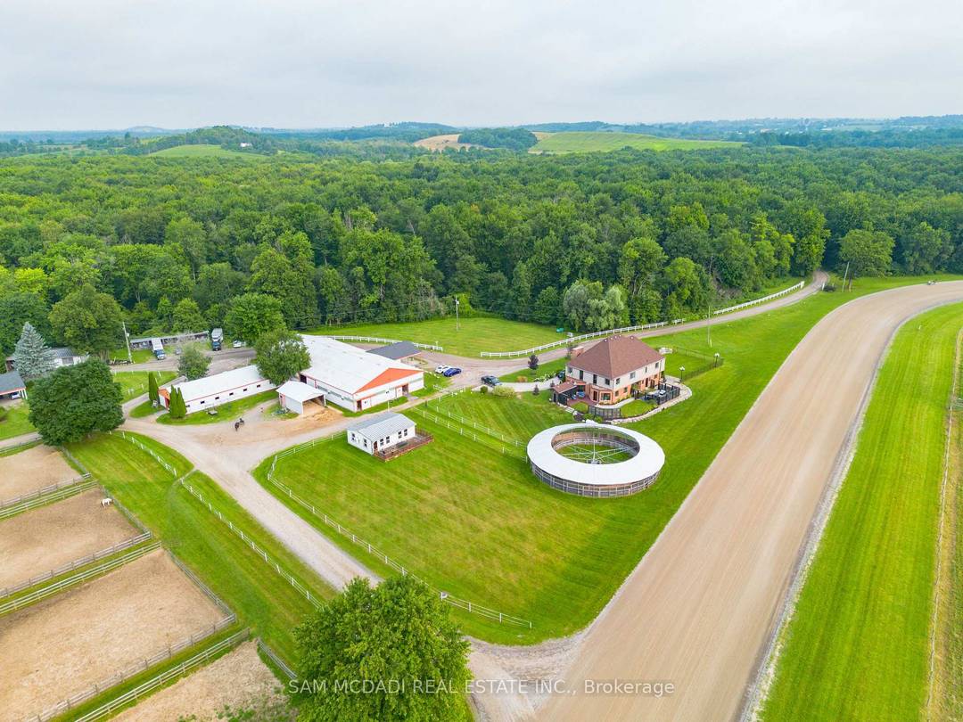 Motivated Seller ! ! Presenting a rare 98 acre estate that seamlessly blends luxury living, natural beauty, and income generating infrastructure, supported by two separate deeds.