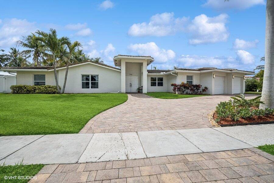 Modern Elegance Meets Ideal Functionality 4BR 4BA Pool Home in Prime Boca Raton Location.