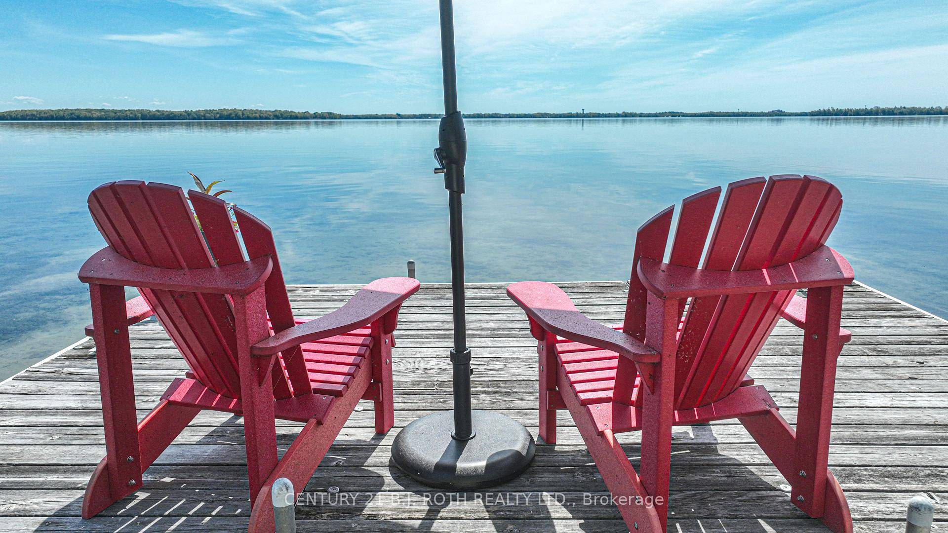 Welcome to 3939 Menoke Beach Road, an extraordinary waterfront property nestled on the pristine shores of Lake Couchiching.