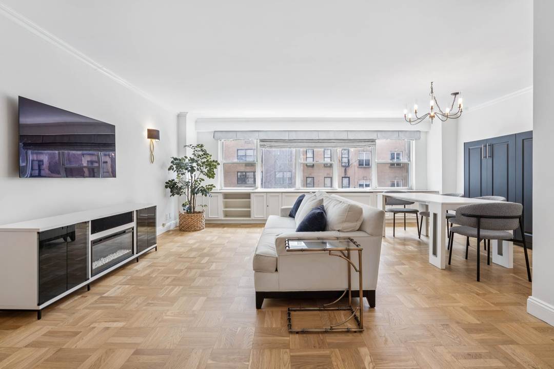 Rare opportunity to own a stunning, sunlit, COMPLETELY RENOVATED oversized 1 bedroom plus custom home office with a Miele WASHER DRYER, and easily convertible to a 2 bedroom.