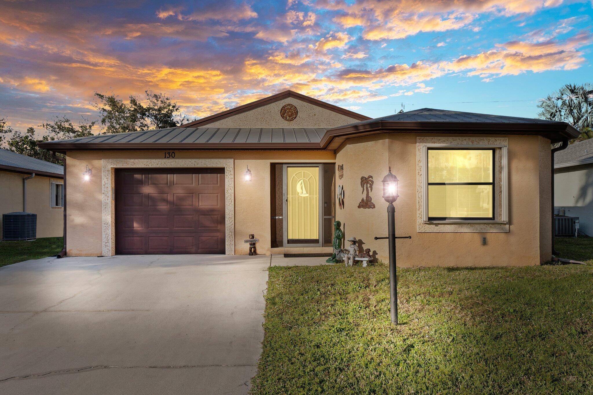This beautiful CBS home offers the perfect blend of modern comfort and tranquil living in the desirable 55 community of Spanish Lakes.