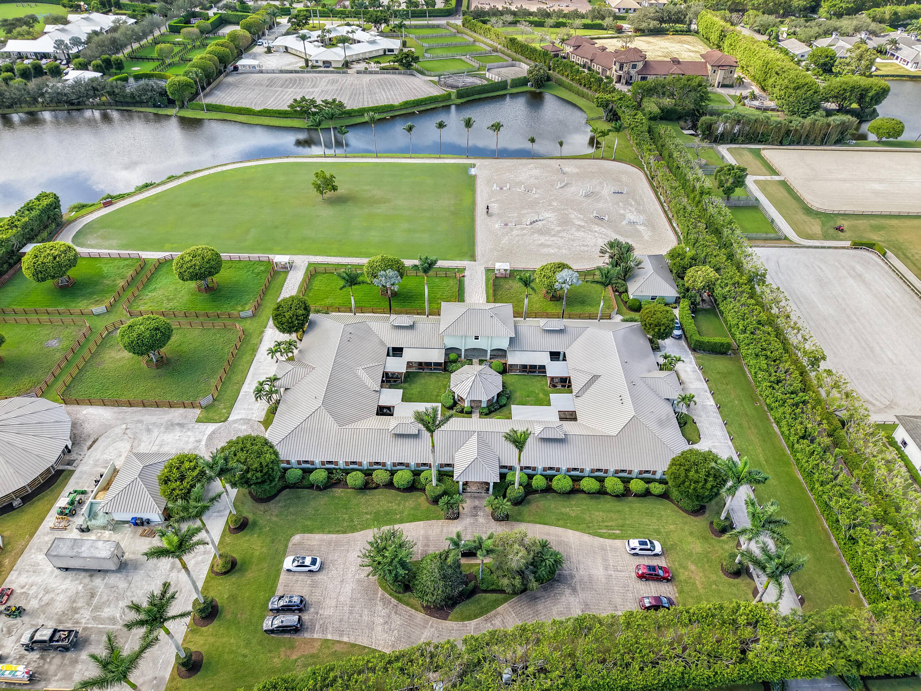 Exceptional equestrian estate located in the prestigious Grand Prix Village, just steps from the bridle path with direct access to Wellington International, the renowned home of world class horse shows.