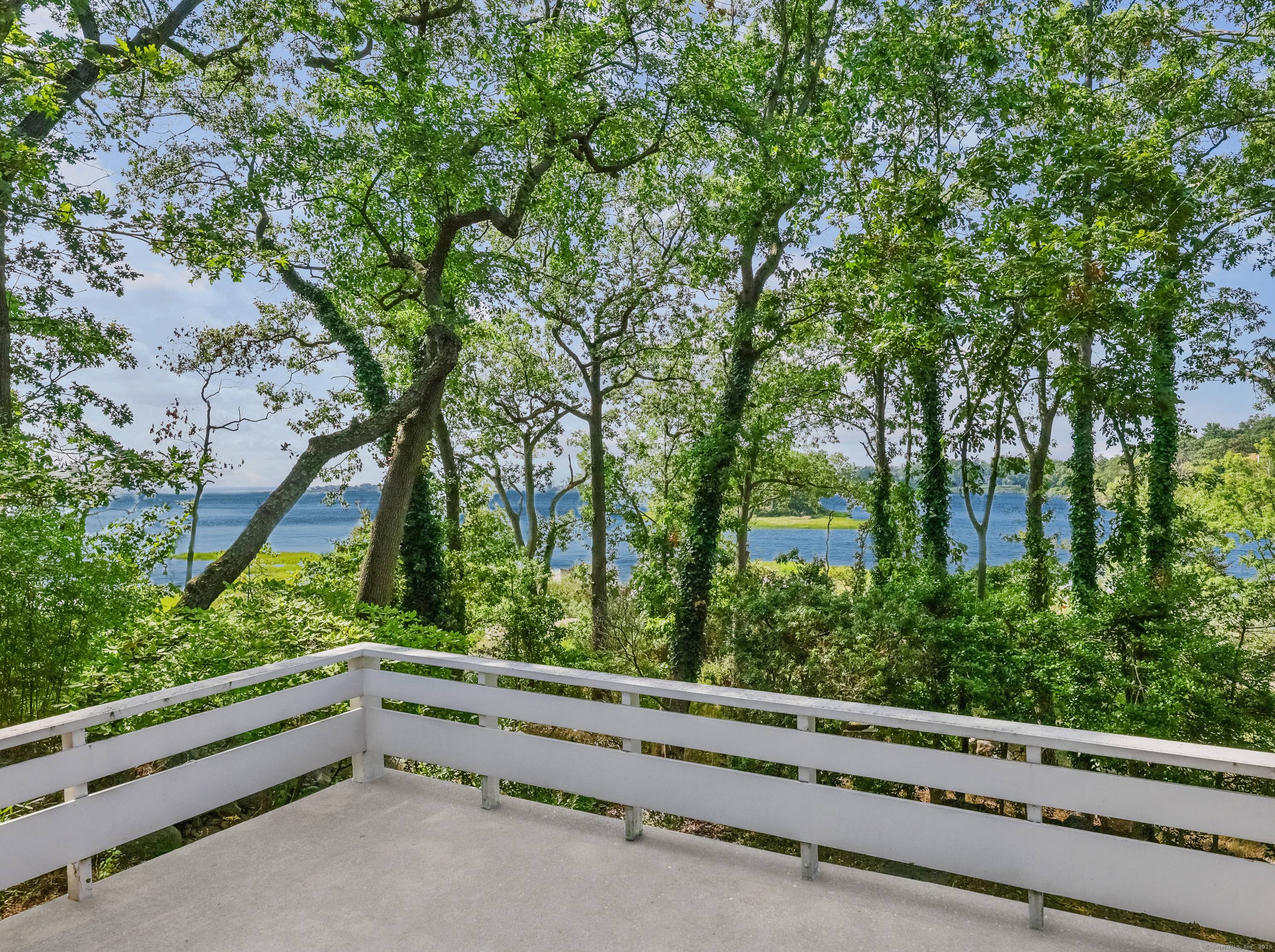 Rare mid century modern elevated waterfront property with extraordinary views in historic Village Creek.