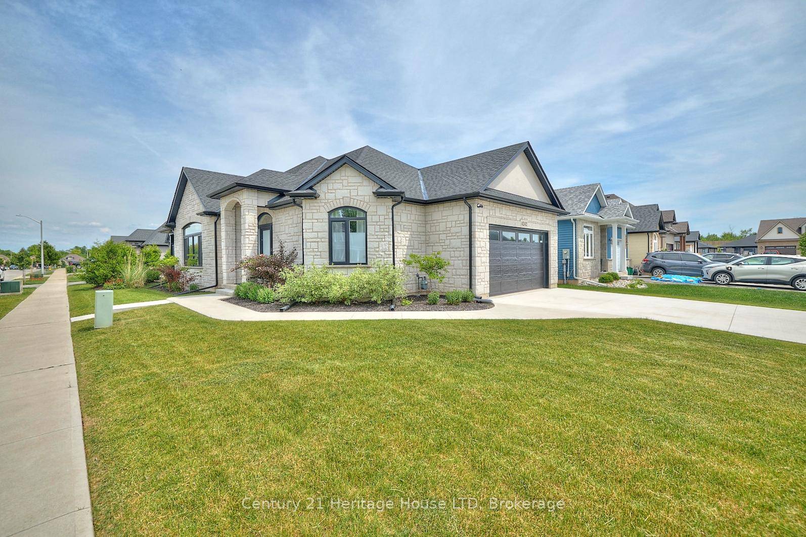 Modern elegance awaits you in this stunning bungalow offering over 2, 400 sq ft of finished living space !