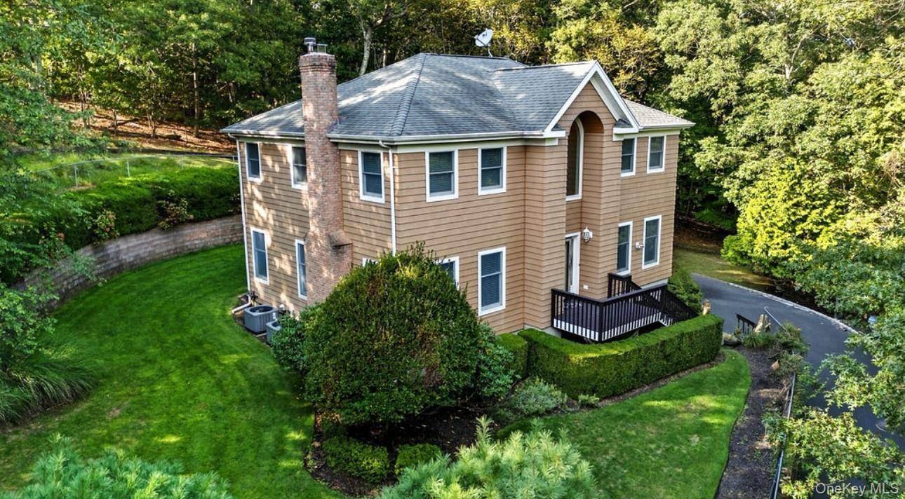Beautifully Maintained Colonial in a Picturesque Setting !